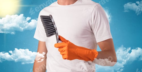 Preview: Sunny And Cloudy Concept With Male Housekeeper And Orange Gloves On His Hand