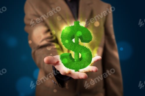 Preview: Young Business Man In Suit Presenting Green Glowing Dollar Sign