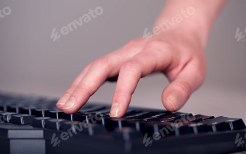 Preview: Close Up Of Hand Pressing Keyboard Buttons On Desk
