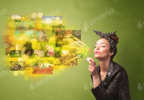 Preview: Cute Girl Blowing Colourful Glowing Memory Picture Concept On Green Background