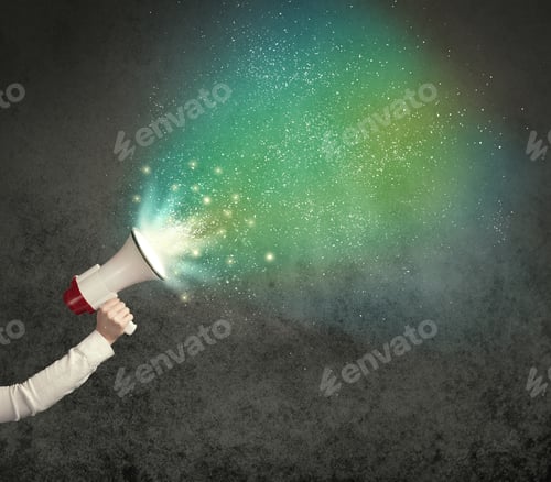 Preview: Caucasian Business Hand Holding Megaphone With White Sparkles On A Grunge Background