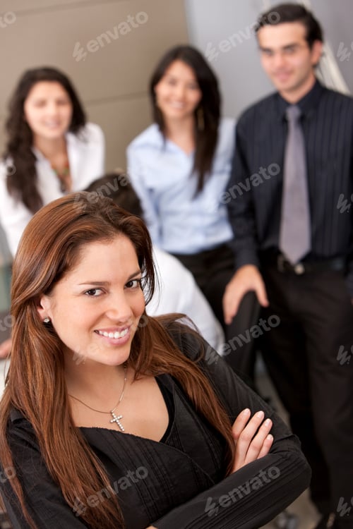 Preview: Business Woman And Her Team Behind Her At An Office