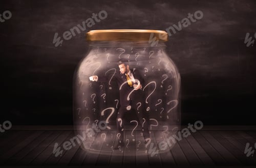 Preview: Businessman Locked Into A Jar With Question Marks Concept On Background