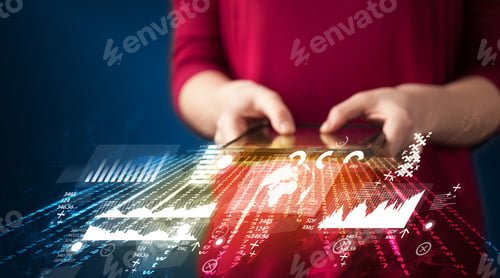 Preview: Hand Holding Touchpad Tablet With Business Market Graphs And Icons Concept On Background