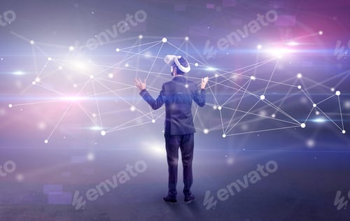 Preview: Young Businessman Standing With Vj Glasses And Checking Life-Sized Connectivity Project