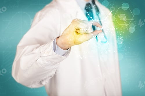 Preview: A Male Doctor In White Coat With A Stethoscope Holding A Pill With Glowing Colorful Dots And Lines