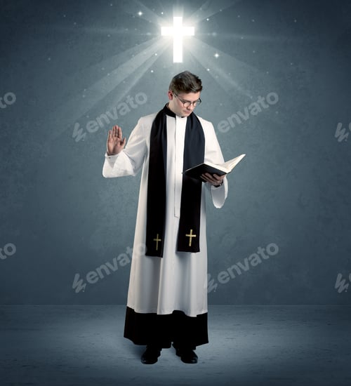 Preview: A Young Caucasian Priest With Deep Faith Blessing With The Holy Bible In His Hand In Front Of Blue