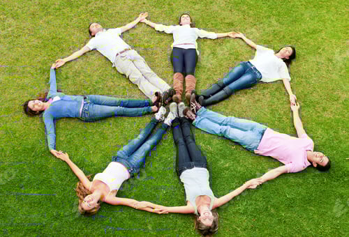 Preview: Circle Of Friends Lying On The Grass Outdoors And Smiling