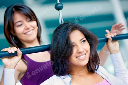 Preview: Girls At The Gym Doing Upper Back Machine Exercises