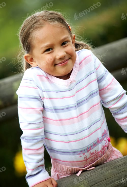 Preview: Little Girl Portrait Outdoors Smiling Over A Wblue Sky In The Background