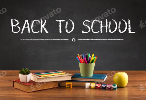 Preview: Back To School Concept With Writing On Blackboard In Capital Letters And A Desk With Papers, Fruit