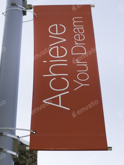 Preview: Motivational Banner On Campus Of Community College: Achieve Your Dream