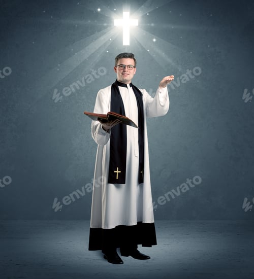 Preview: A Young Caucasian Priest With Deep Faith Blessing With The Holy Bible In His Hand In Front Of Blue