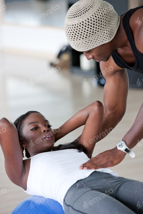 Preview: Gym Woman And Her Trainer Doing Exercise At The Gym
