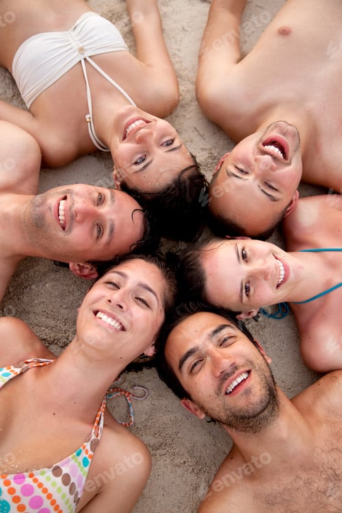 Preview: Friends At The Beach With Their Heads Together On The Floor