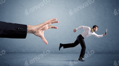 Preview: Young Miniature Businessman Running From A Big Hand With Blue Background