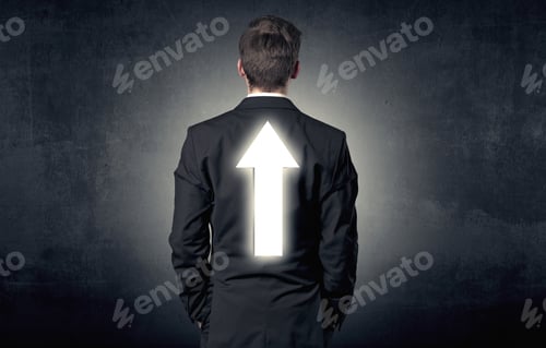 Preview: Young Businessman Standing And Thinking About Which Direction To Choose