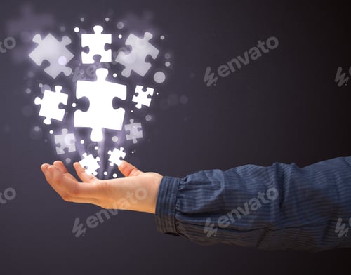 Preview: Woman Holding Shining Puzzle Pieces In Her Hand