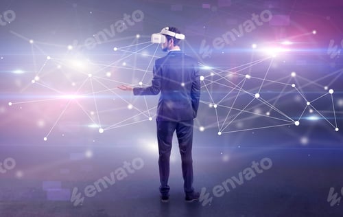 Preview: Young Businessman Standing With Vj Glasses And Checking Life-Sized Connectivity Project
