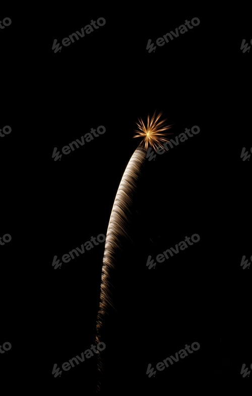 Preview: Feathery White Rocket Trail Ending In Small, Reddish-Orange Burst Of Fireworks