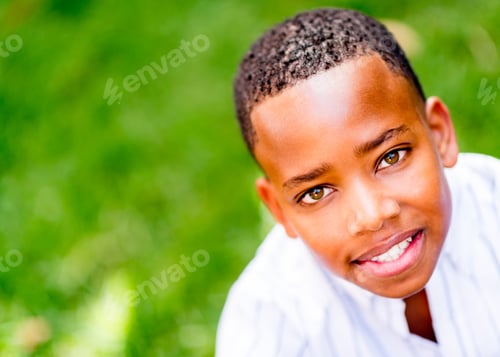 Preview: Portrait Of A Happy Black Kid Smiling At The Park