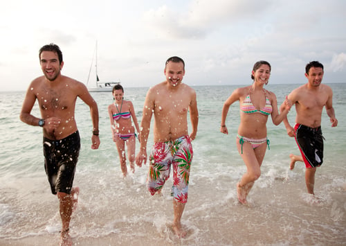 Preview: Happy Group Of Friends Running At The Beach