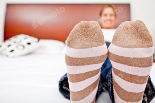 Preview: Woman Resting And Lying On The Bed - Focus On Feet