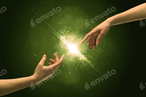 Preview: Two Naked Male Hands About To Touch, Lighting The Spark With Modest Explosion In Front Of Green