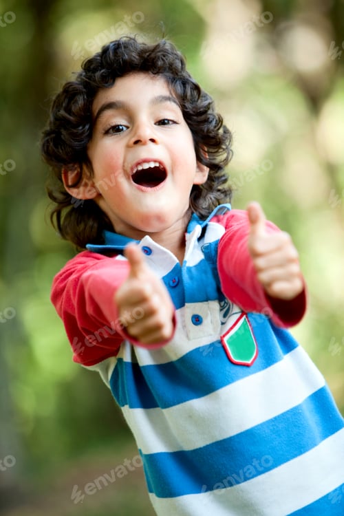 Preview: Little Latinamerican Boy Playing Outdoors With Thumbs Up