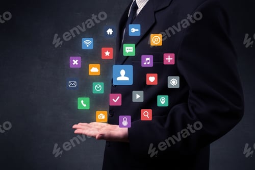 Preview: Colorful Multimedia Icons In The Hands Of A Businessman