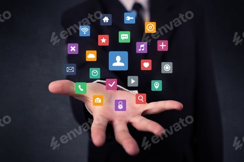 Preview: Colorful Multimedia Icons In The Hands Of A Businessman