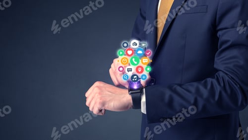 Preview: Businessman Wearing Smartwatch With Colored Application Symbols On It.