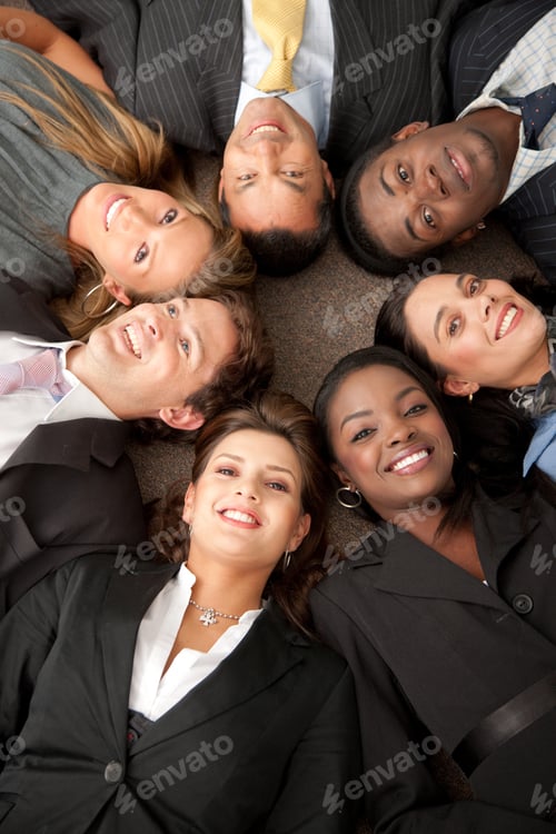 Preview: Multi-Ethnic Business Teamwork In An Office With Heads Together On The Floor