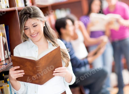 Preview: Beautiful Female Student Reading A Book At The Library