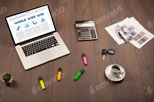 Preview: Laptop Computer On Wooden Desk With Office Suplies