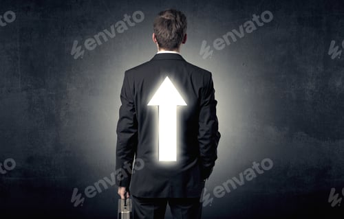 Preview: Young Businessman Standing And Thinking About Which Direction To Choose