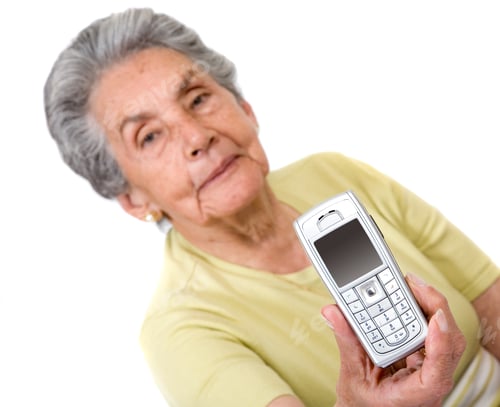 Preview: Smiling Senior Woman Holding Mobile Phone