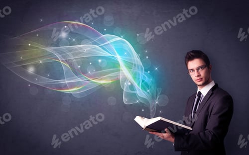 Preview: Casual Young Man Holding Book With Rainbow Waves Flying Out Of It