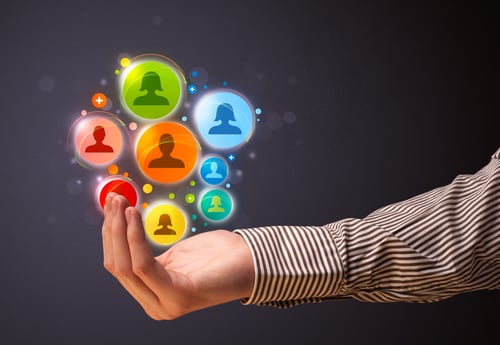 Businessman Holding Colorful Social Network Icons In His Hand