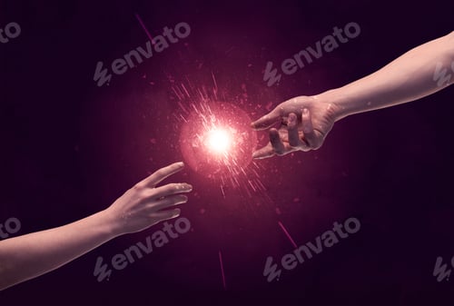 Preview: White Caucasian Male Hands Reaching Out With Fingers Almost Touching In Bright Red Light Sparkle In