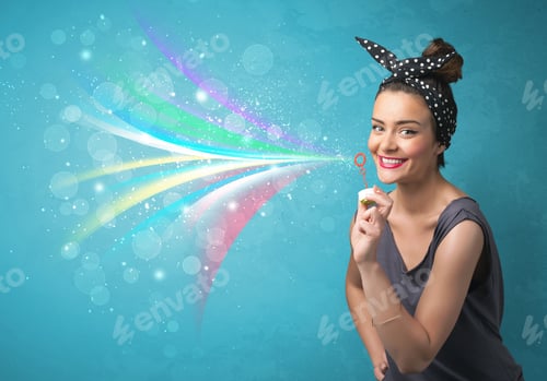 Preview: Beautiful Girl Blowing Abstract Colorful Bubbles And Lines On Blue Background