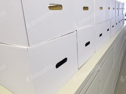 Preview: Neatness At The Office: White Cardboard Storage Boxes Stacked Along Top Of Corridor Cabinet