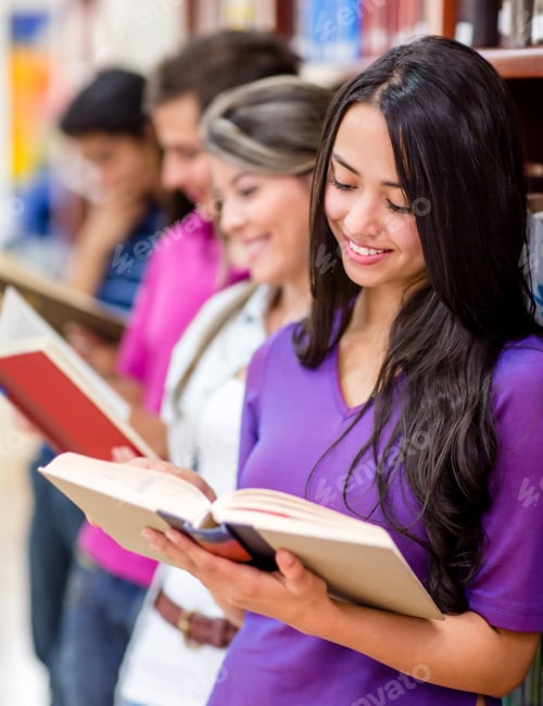 Preview: Group Of Students Investigating At The Library And Reading Books