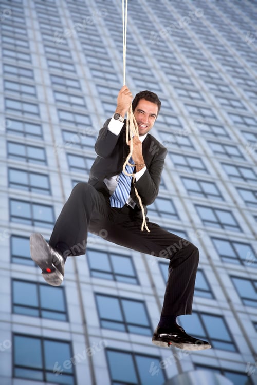 Preview: Business Man Jumping From A Building With A Rope
