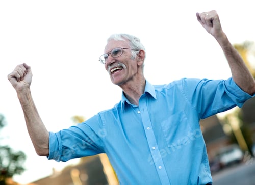 Preview: Excited Senior Man Enjoying His Retirement With Arms Up