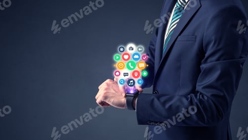 Preview: Businessman Wearing Smartwatch With Colored Application Symbols On It.