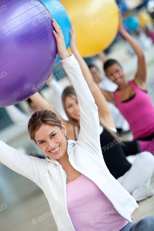 Preview: Group Of People At The Gym Smiling With A Pilates Ball