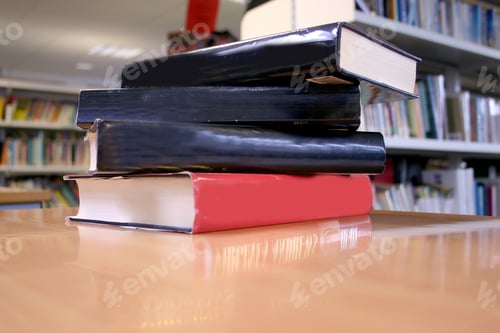 Preview: Books On A Desk At A Library