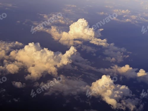 Preview: Aerial View At Sunset: Tops Of Cumulus Clouds Seen From 30,000 Feet Or Higher Over Land