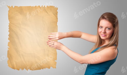 Preview: Beautiful Young Girl Presenting Old Paper Copy Space